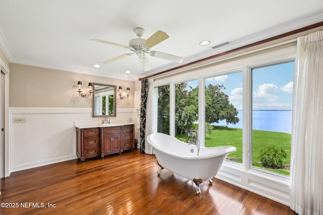 145 River Rd, Orange Park, FL 32073 - full bathroom featuring a water view, vanity, a freestanding bath, a ceiling fan, and wood-type flooring