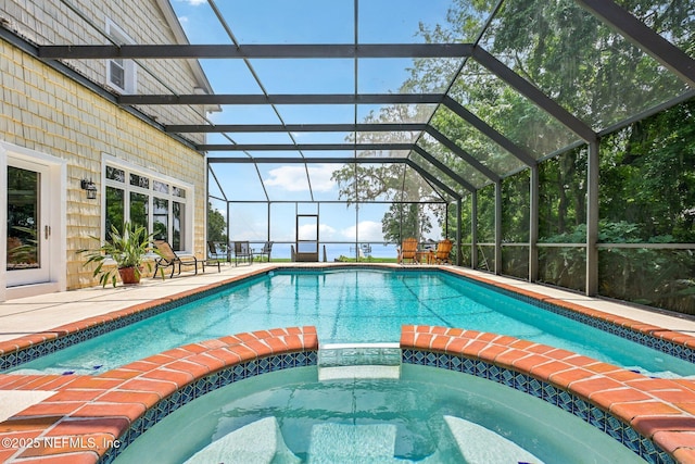 145 River Rd, Orange Park, FL 32073 - view of pool with a pool with connected hot tub, a patio area, and a lanai