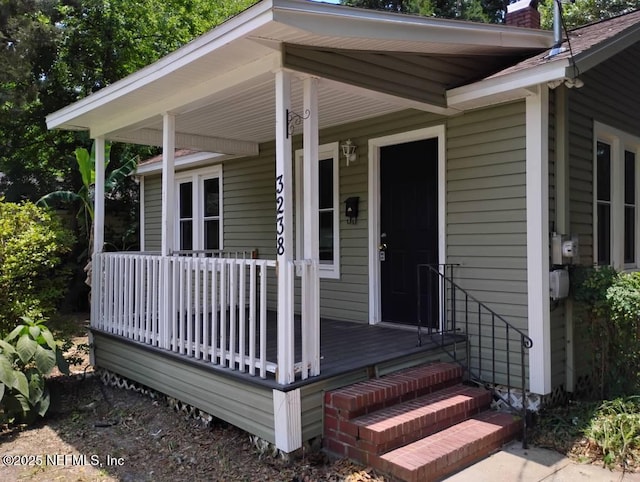 3238 Green St, Jacksonville, FL 32205 - entrance to property with a chimney and covered porch