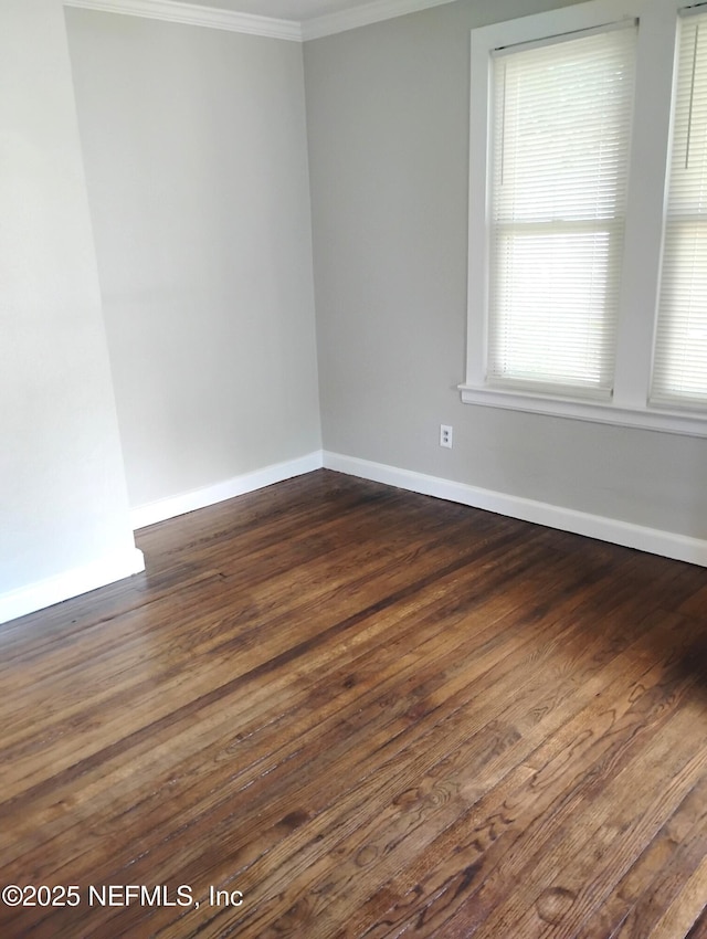 3238 Green St, Jacksonville, FL 32205 - spare room featuring crown molding, dark wood finished floors, and baseboards