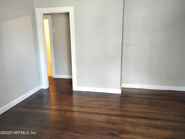 3238 Green St, Jacksonville, FL 32205 - unfurnished room featuring dark wood-type flooring and baseboards