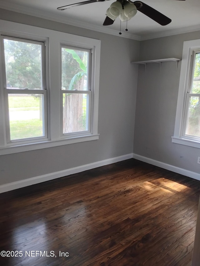3238 Green St, Jacksonville, FL 32205 - spare room featuring ornamental molding, a ceiling fan, dark wood-style flooring, and baseboards