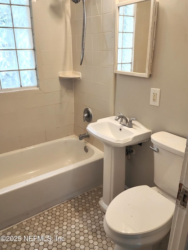 3238 Green St, Jacksonville, FL 32205 - bathroom featuring toilet, bathtub / shower combination, and tile patterned flooring