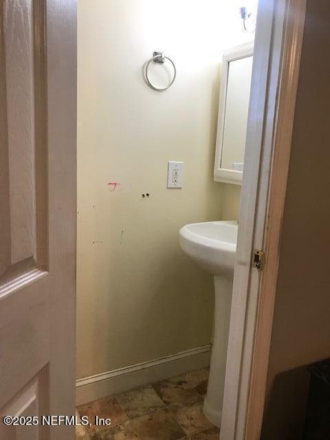 2404 Crill Ave, Palatka, FL 32177 - bathroom with baseboards