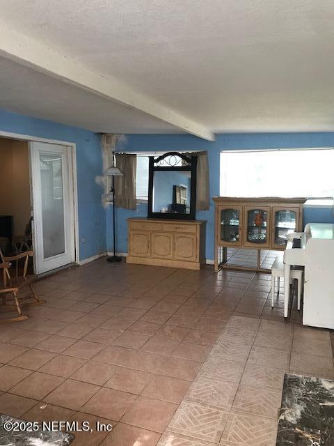 2404 Crill Ave, Palatka, FL 32177 - living room with tile patterned floors and baseboards