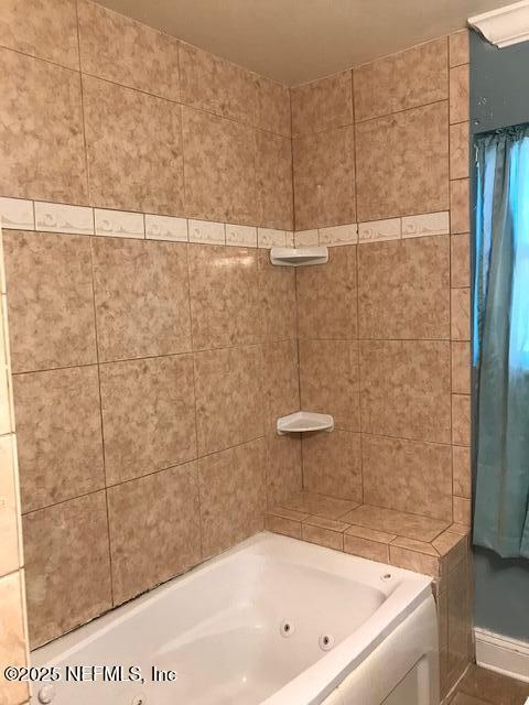 2404 Crill Ave, Palatka, FL 32177 - bathroom with a combined bath / shower with jetted tub