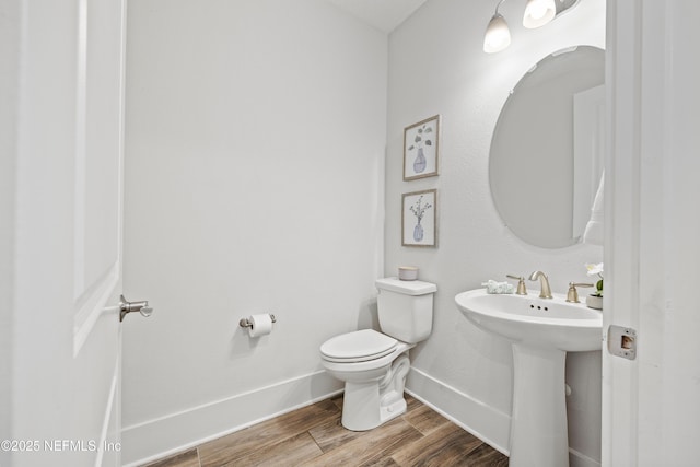 85 Park Center Ave, Ponte Vedra, FL 32081 - bathroom featuring toilet, baseboards, wood finished floors, and a sink