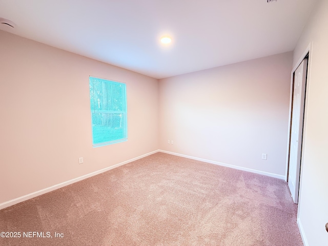 6971 Como Rd, Jacksonville, FL 32210 - empty room with carpet floors, baseboards, and a smoke detector