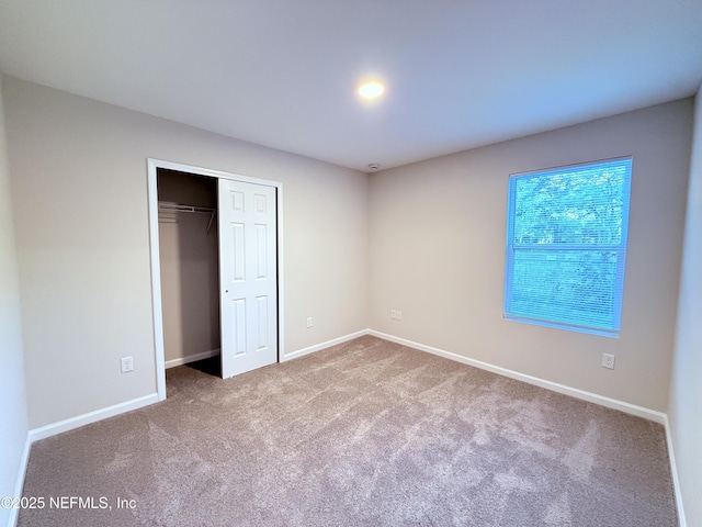 6971 Como Rd, Jacksonville, FL 32210 - unfurnished bedroom with carpet, baseboards, and a closet