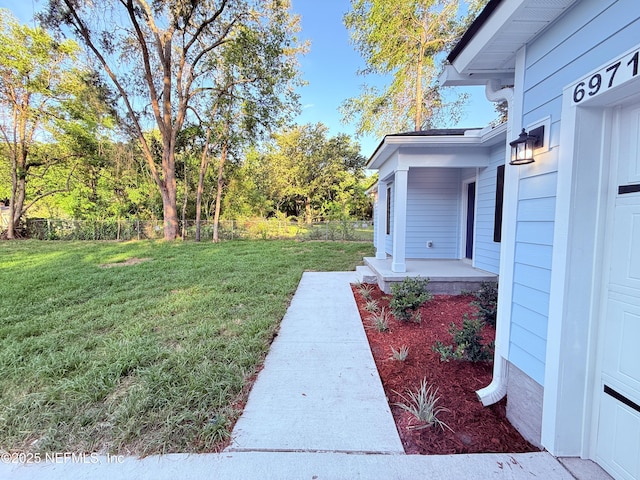 6971 Como Rd, Jacksonville, FL 32210 - view of grassy yard featuring a porch