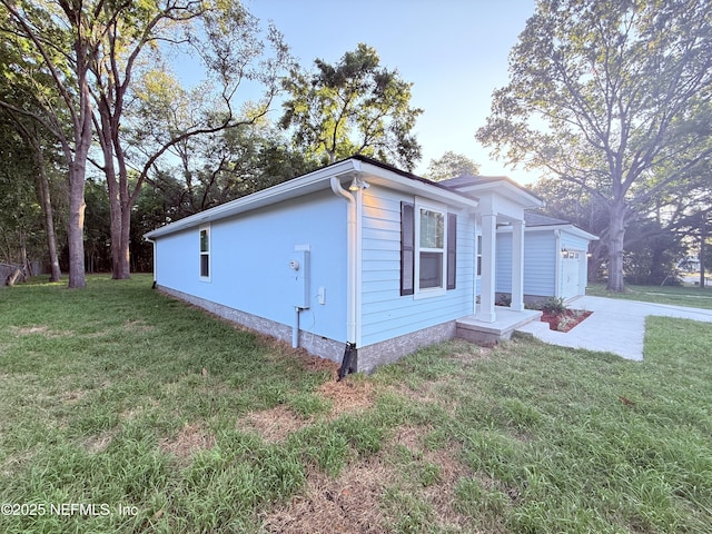6971 Como Rd, Jacksonville, FL 32210 - view of home's exterior with a yard and an attached garage