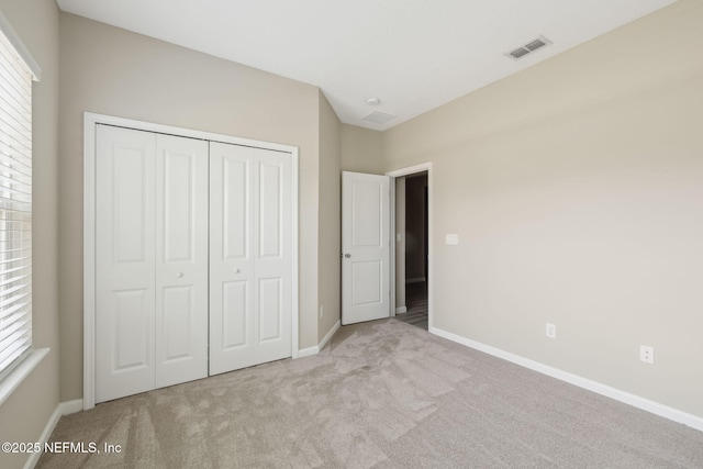 2724 White Cedar Ln, Green Cove Springs, FL 32043 - unfurnished bedroom featuring carpet flooring, a closet, and baseboards