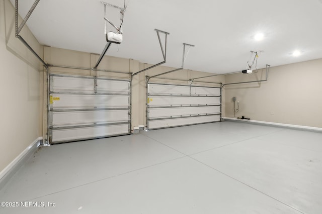2724 White Cedar Ln, Green Cove Springs, FL 32043 - garage featuring a garage door opener and baseboards