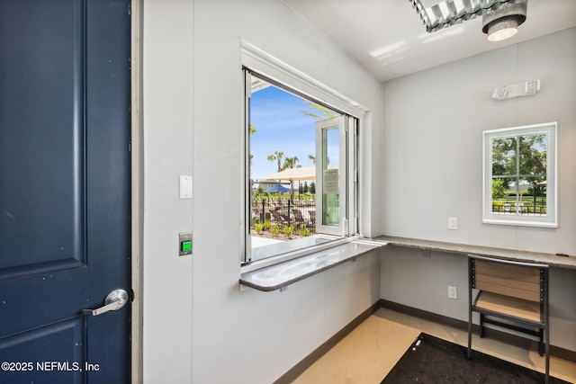 2724 White Cedar Ln, Green Cove Springs, FL 32043 - unfurnished office with healthy amount of natural light, built in study area, and baseboards