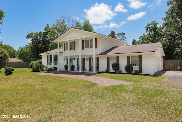 17459 Eagle Bend Blvd, Jacksonville, FL 32226 - neoclassical home featuring a chimney, an attached garage, covered porch, brick siding, and driveway