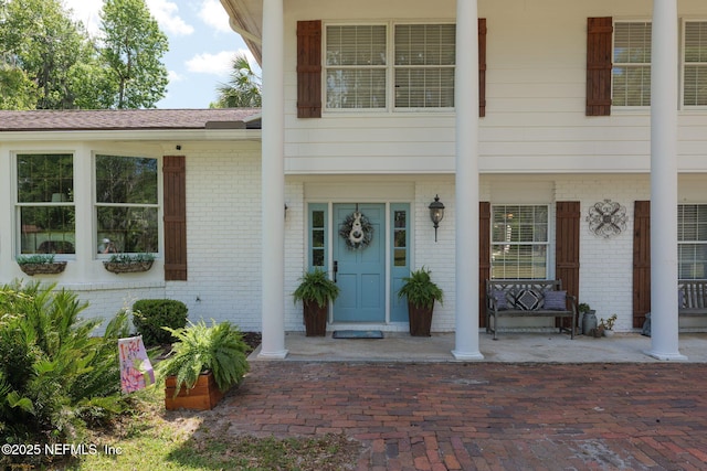 17459 Eagle Bend Blvd, Jacksonville, FL 32226 - view of exterior entry featuring brick siding and covered porch