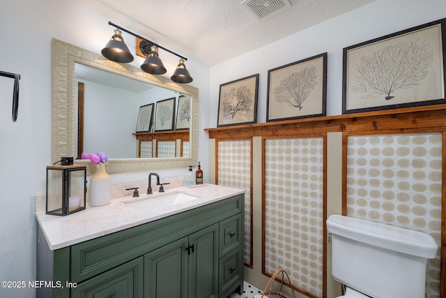 17459 Eagle Bend Blvd, Jacksonville, FL 32226 - bathroom featuring toilet, vanity, and a textured ceiling