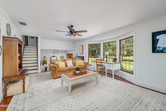 17459 Eagle Bend Blvd, Jacksonville, FL 32226 - living area featuring ceiling fan, crown molding, baseboards, wood finished floors, and stairs