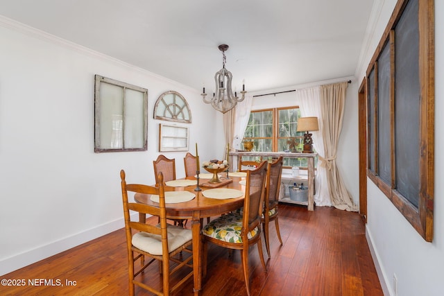 17459 Eagle Bend Blvd, Jacksonville, FL 32226 - dining space with baseboards, a chandelier, dark wood-style floors, and ornamental molding