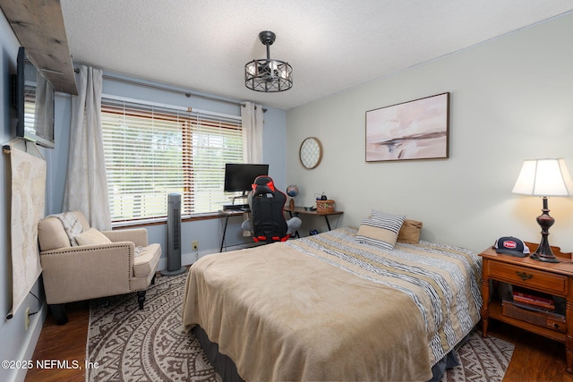 17459 Eagle Bend Blvd, Jacksonville, FL 32226 - bedroom with wood finished floors, a textured ceiling, and baseboards