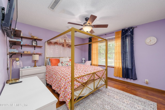 17459 Eagle Bend Blvd, Jacksonville, FL 32226 - bedroom featuring wood finished floors, a textured ceiling, and ceiling fan