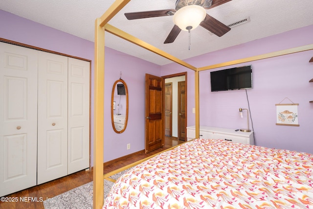 17459 Eagle Bend Blvd, Jacksonville, FL 32226 - bedroom featuring wood finished floors, a textured ceiling, a closet, ceiling fan, and baseboards