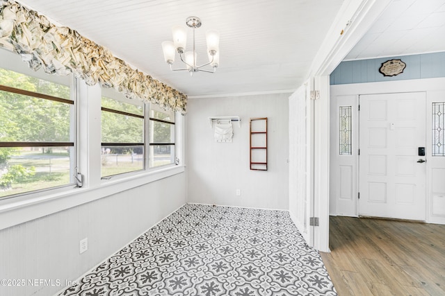 2505 State St, Palatka, FL 32177 - unfurnished dining area with a chandelier and wood finished floors