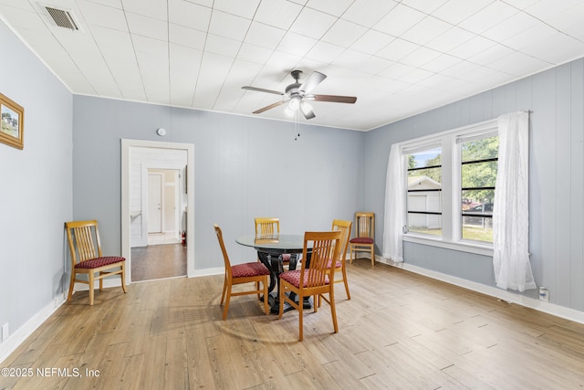 2505 State St, Palatka, FL 32177 - dining space with light wood finished floors, a ceiling fan, and baseboards