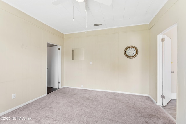 2505 State St, Palatka, FL 32177 - carpeted empty room with ceiling fan, crown molding, and baseboards