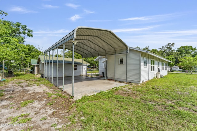 2505 State St, Palatka, FL 32177 - view of car parking with a detached carport and dirt driveway