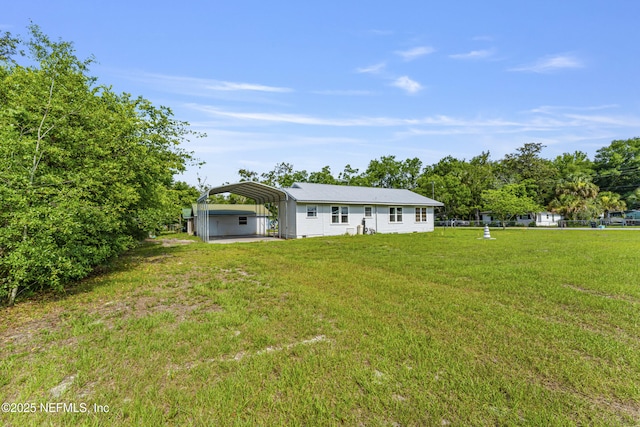 2505 State St, Palatka, FL 32177 - view of grassy yard featuring a detached carport