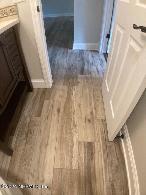5615 San Juan Ave Unit 310, Jacksonville, FL 32210 - detailed view of wood finished floors and baseboards