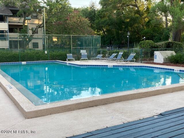 5615 San Juan Ave Unit 310, Jacksonville, FL 32210 - community pool featuring view of scattered trees