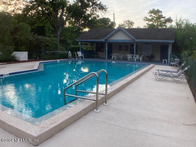 5615 San Juan Ave Unit 310, Jacksonville, FL 32210 - community pool featuring a patio area and an outdoor structure