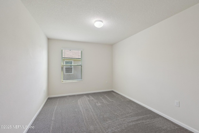 96 Cody St, Saint Augustine, FL 32084 - spare room with carpet flooring, a textured ceiling, and baseboards