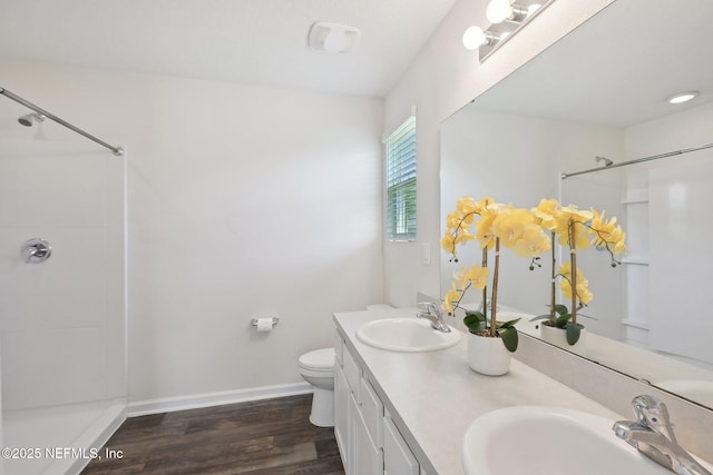 96 Cody St, Saint Augustine, FL 32084 - full bath featuring a shower, baseboards, wood finished floors, and double vanity