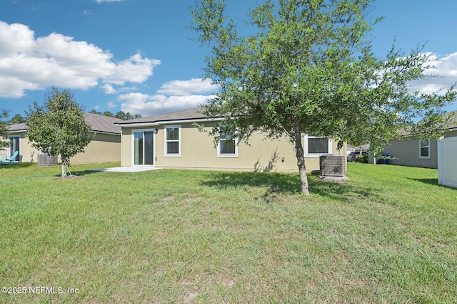 96 Cody St, Saint Augustine, FL 32084 - rear view of property featuring a yard and stucco siding