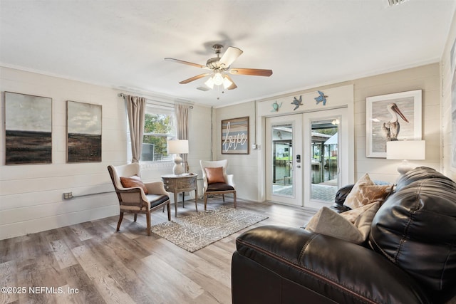 157 Smith Ln, Satsuma, FL 32189 - living room featuring ceiling fan, french doors, light wood finished floors, and crown molding