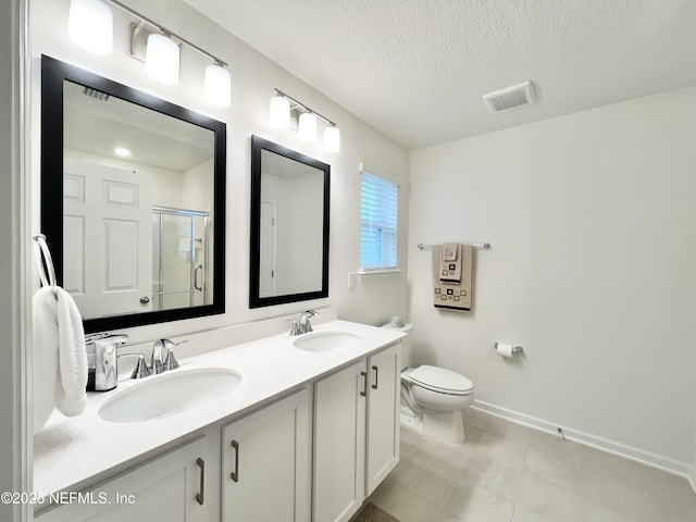354 Boulder Ln, Saint Johns, FL 32259 - full bath with double vanity, toilet, a stall shower, a textured ceiling, and baseboards