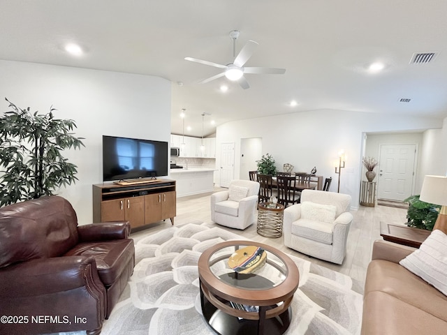 354 Boulder Ln, Saint Johns, FL 32259 - living room with vaulted ceiling, ceiling fan, light wood-type flooring, and recessed lighting