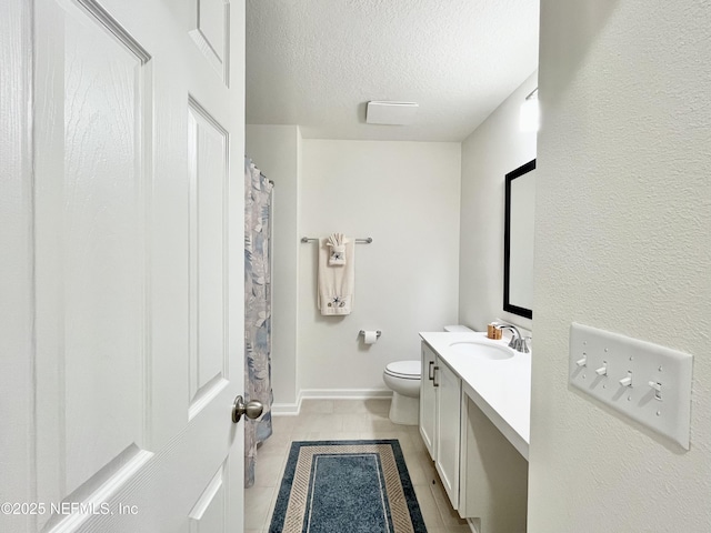 354 Boulder Ln, Saint Johns, FL 32259 - full bathroom featuring vanity, a textured ceiling, toilet, tile patterned flooring, and baseboards