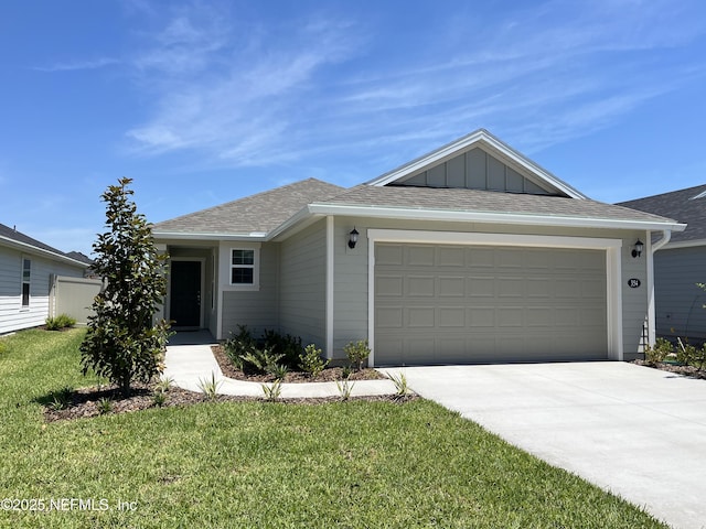 354 Boulder Ln, Saint Johns, FL 32259 - single story home with driveway, a garage, a shingled roof, and board and batten siding