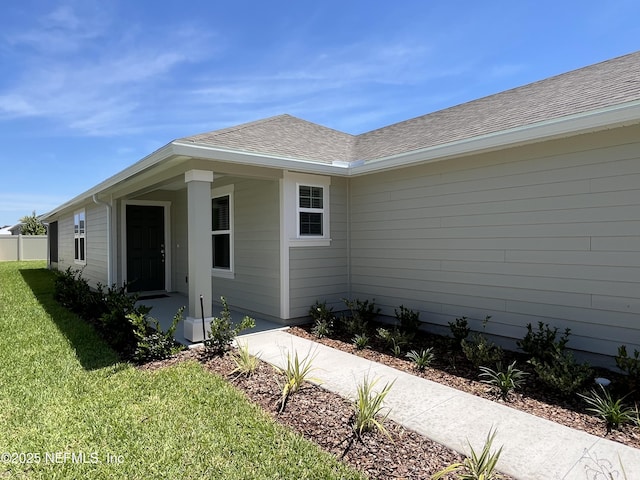 354 Boulder Ln, Saint Johns, FL 32259 - view of side of property featuring a lawn and a shingled roof