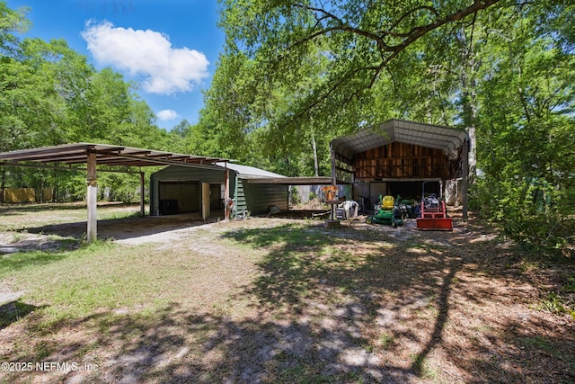2708 Poinsettia Ave, Middleburg, FL 32068 - view of yard featuring an outbuilding, a garage, and a pole building