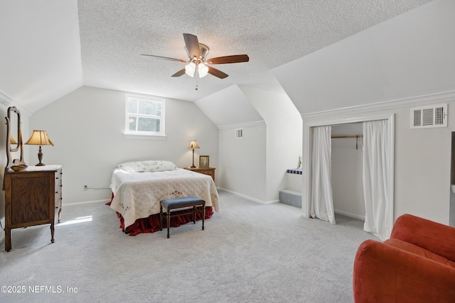 2708 Poinsettia Ave, Middleburg, FL 32068 - bedroom featuring vaulted ceiling, carpet flooring, baseboards, ceiling fan, and a textured ceiling