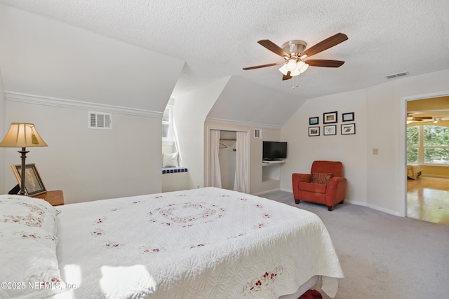 2708 Poinsettia Ave, Middleburg, FL 32068 - bedroom featuring carpet, vaulted ceiling, baseboards, ceiling fan, and a textured ceiling