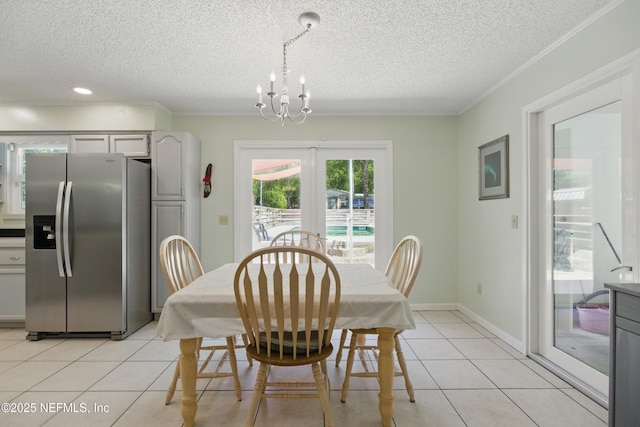 2708 Poinsettia Ave, Middleburg, FL 32068 - dining area with a chandelier, crown molding, a textured ceiling, light tile patterned flooring, and french doors