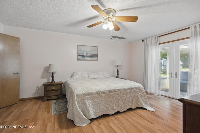 2708 Poinsettia Ave, Middleburg, FL 32068 - bedroom with access to outside, light wood-type flooring, a textured ceiling, a ceiling fan, and baseboards