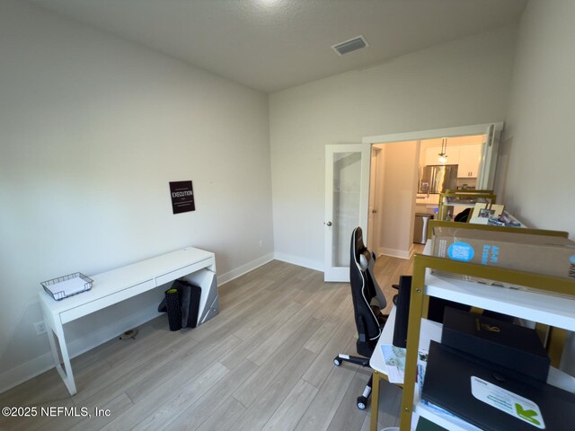 10065 Element Rd, Jacksonville, FL 32256 - office area featuring light wood-type flooring, baseboards, and french doors
