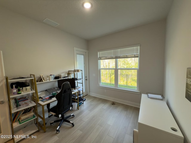 10065 Element Rd, Jacksonville, FL 32256 - home office featuring wood finished floors and baseboards